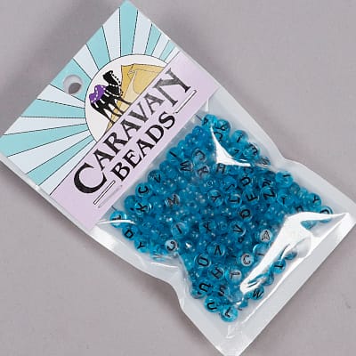 PL-A21: Transparent Teal Letter Beads 