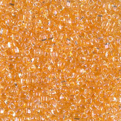 TR10-1107:  Miyuki 10/0 Triangle Apricot Lined Crystal 
